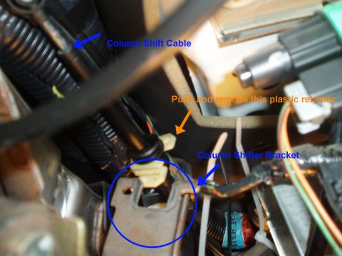 2003 Ford Crown Victoria - use a small flat head screw driver to pull the taps on the plastic clip, once free push it off the metal bracket.