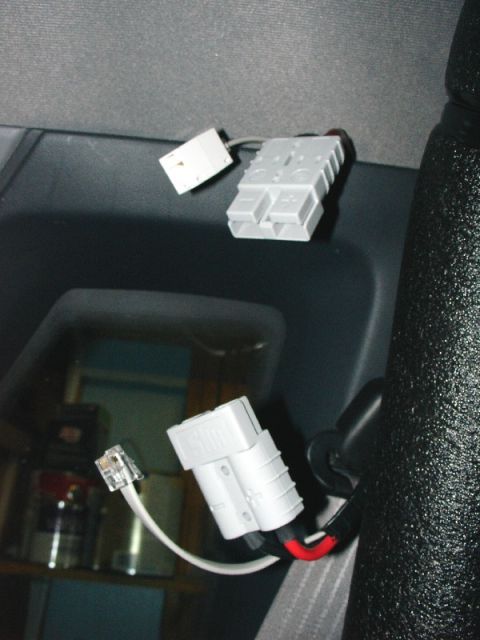1993 Ford Mustang - Close-up of electrical connectors and wiring, possibly for auxiliary power.