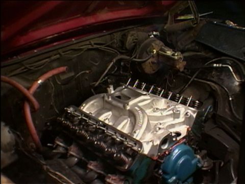 1967 Ford Galaxie - Close-up view of an engine bay a newly installed aluminum intake manifold and valve covers.