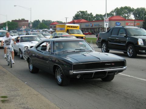 1988 Mercury Grand Marquis - A 1969 Dodge Charger is seen in traffic alongside other vehicles.