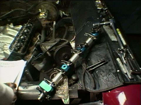 1967 Ford Galaxie - Engine parts and tools are arranged on a surface, with a handwritten note nearby.
