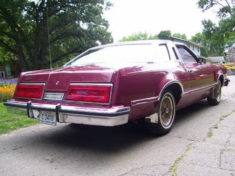 1979 Ford Thunderbird - Rear view of a 1979 Ford Thunderbird coupe with a purple finish and chrome accents.