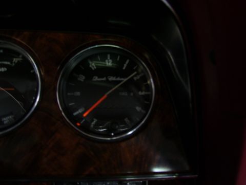 1979 Ford Thunderbird - The dashboard features woodgrain trim and two prominent gauges, one of which indicates the fuel level.