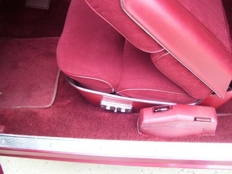 1979 Ford Thunderbird - Interior view of a vehicle's red seats, floor, and console, with a watermark at the bottom.