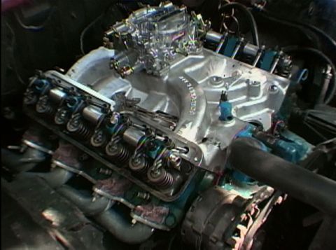 1967 Ford Galaxie - Close-up view of a modified V8 engine, a prominent carburetor and intake system.
