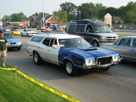 1988 Mercury Grand Marquis - This two-tone station wagon, likely a 1973 model, is part of a cruise event with other vehicles visible.