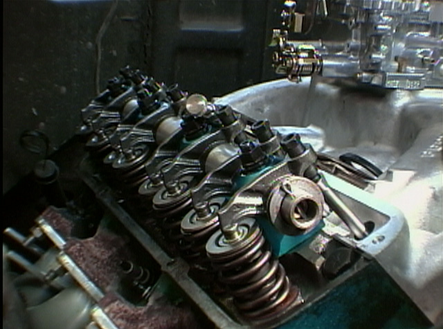 Cylinder head valvetrain with rocker arms, valve springs and pushrods exposed