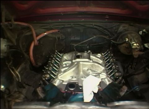 1967 Ford Galaxie - Close-up view of a V8 engine in a vehicle's engine bay, showing the intake and valve covers.