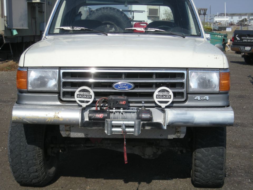 1991 Ford Bronco front grille, headlights, and winch. 4x4 badge visible