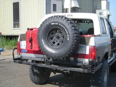 1991 Ford Bronco - This Ford Bronco is equipped for off-road adventures with a large spare tire and a jerrycan mounted on its rear.