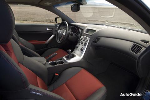 2010 Hyundai Genesis - The interior of a 2010 Hyundai Genesis coupe features a sporty design with contrasting seat colors and a modern dashboard.