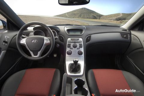 2010 Hyundai Genesis - The interior of a Hyundai Genesis shows dual-tone seats and a central console with a gear shifter.
