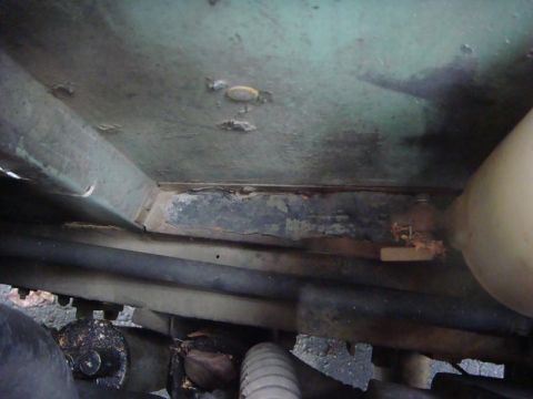 1967 Land Rover Land Rover - Close-up view of the undercarriage, revealing signs of wear and tear.
