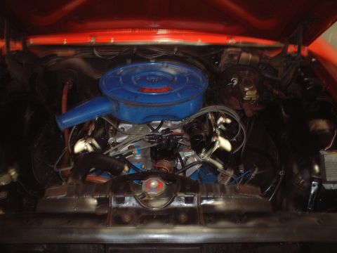 1967 Ford Galaxie - The engine bay of a 1967 Ford Galaxie, showing the V8 engine with a blue air cleaner assembly.