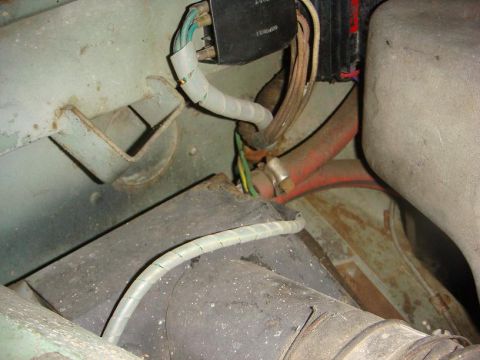 1967 Land Rover Land Rover - Detail of a vehicle's electrical system, various wires and hoses in a somewhat aged condition.