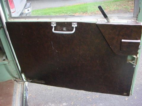 1967 Land Rover Land Rover - Close-up of a Land Rover's interior door panel, showing the textured material and hardware.