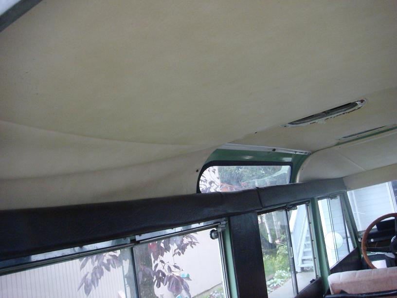 Interior view of a 1967 Land Rover Land Rover, showing the headliner, windows, and part of the steering wheel