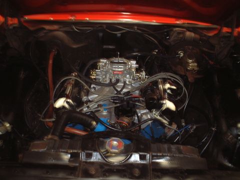 1967 Ford Galaxie - Close-up of a V8 engine bay, an Edelbrock carburetor and various engine components.
