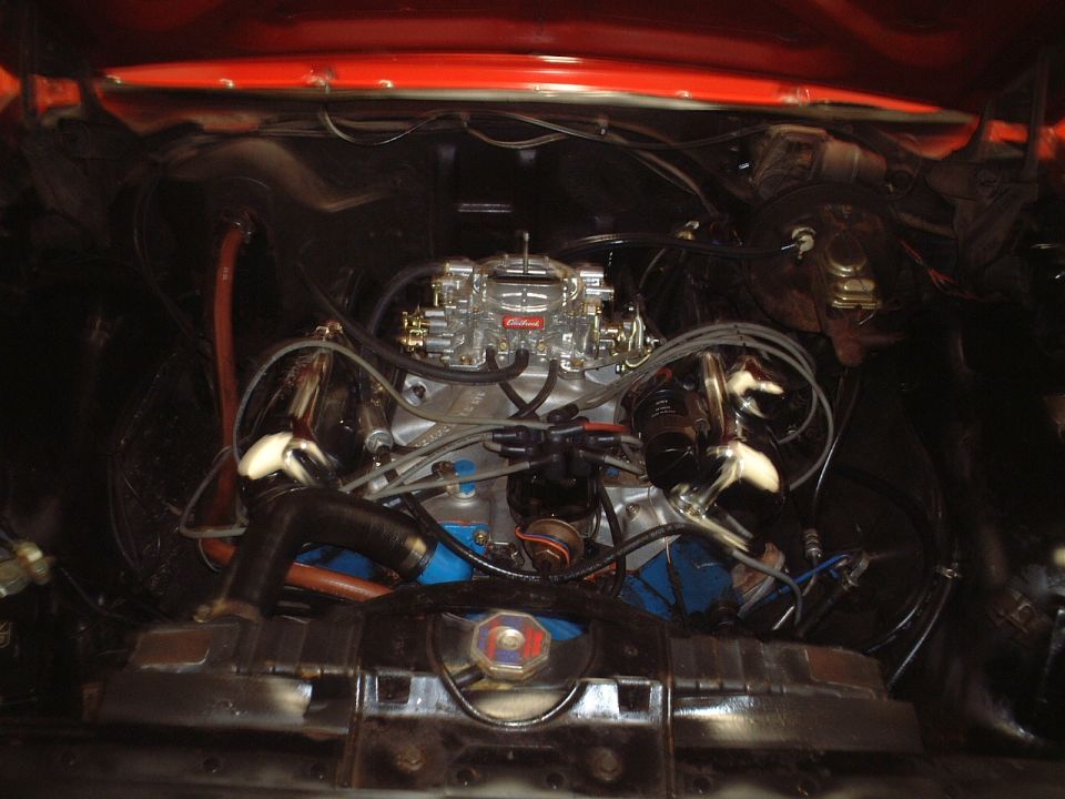 V8 engine bay with Edelbrock carburetor and aluminum intake