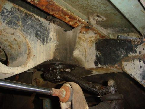 1967 Land Rover Land Rover - Close-up view of the heavily corroded undercarriage of a 1967 Land Rover Land Rover.