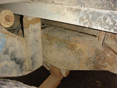1967 Land Rover Land Rover - The underside of a vehicle shows significant rust on the chassis and suspension components.