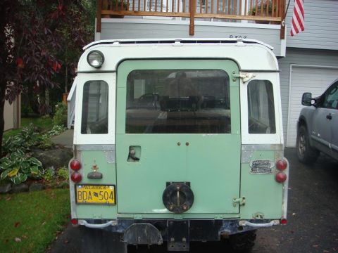 1967 Land Rover Land Rover - The rear of a vintage Land Rover, dual taillights and a spare tire mount.