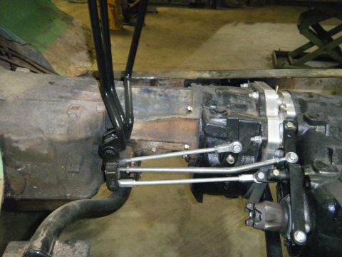 1978 Ford Bronco - Close-up view of the transfer case linkage, showing the shifter levers and connecting rods.