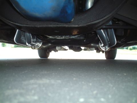 1967 Ford Galaxie - The underside of a vehicle displays its exhaust system, including headers and pipes.