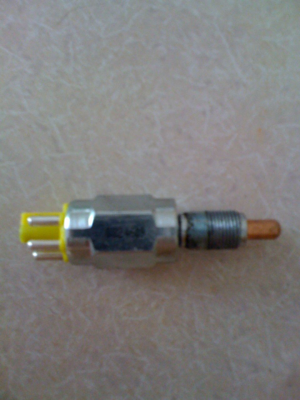 Automotive sensor or switch with yellow connector and copper tip