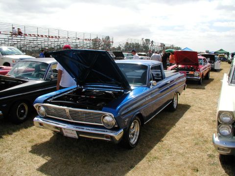 1967 Ford Ranchero - A blue 1966 Ford Falcon Ranchero is displayed with its hood open at a car show.