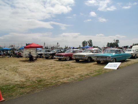1967 Ford Ranchero - Outdoor car show with multiple vintage vehicles on display.