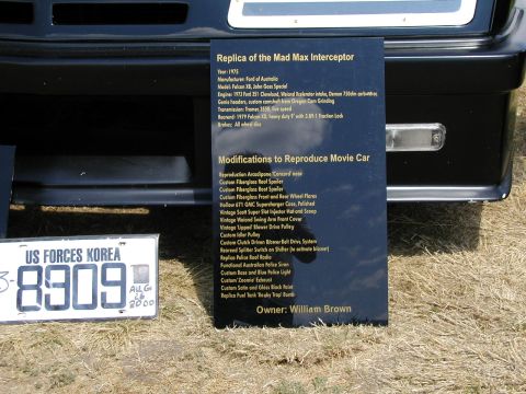1967 Ford Ranchero - This black vehicle is a replica of the Mad Max Interceptor, based on a 1975 Ford Falcon XB, as detailed on the accompanying plaque.