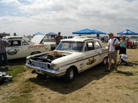 1967 Ford Ranchero - A cream 1967 Ford Ranchero race car is displayed with its hood open at a car show.