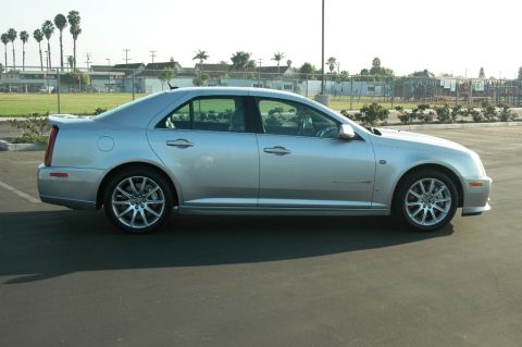 2006 Cadillac STS - A silver 2006 Cadillac STS sedan is shown from its side profile in a parking lot.