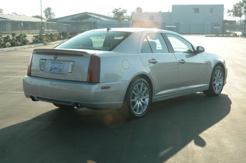 2006 Cadillac STS - Rear view of a silver 2006 Cadillac STS sedan, a spoiler and a custom license plate.