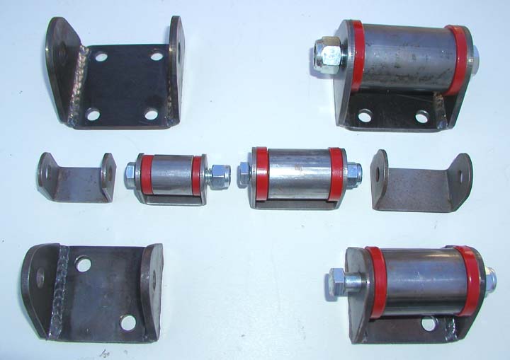 Set of suspension bushings with red urethane and metal brackets