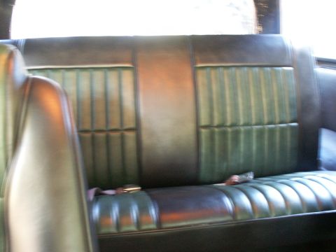 1990 Ford Bronco - Interior view of a vehicle's rear bench seat, showing the upholstery and seatbelt.