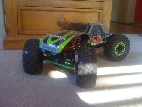 1995 Ford Bronco - This remote control rock crawler features a striking green and silver paint scheme with aggressive off-road tires.