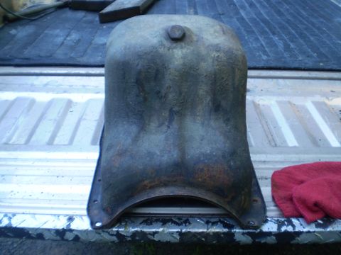 1979 Ford Bronco - This appears to be an oil pan, possibly for an older vehicle, shown resting on a truck bed.
