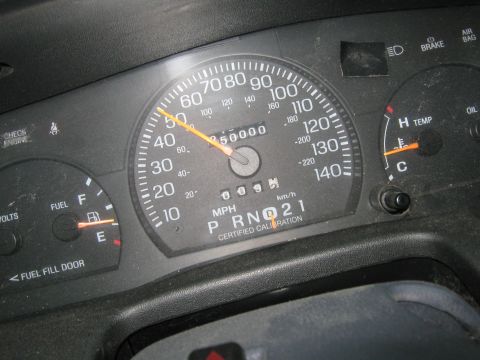 1997 Ford Crown Victoria - The dashboard shows the speedometer, odometer, fuel, and temperature gauges of a vehicle.