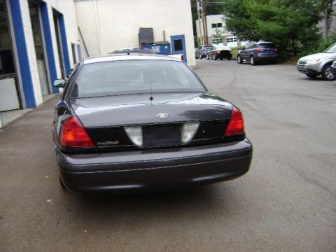 2001 Ford Crown Victoria - Rear view of a dark gray Ford Crown Victoria sedan.