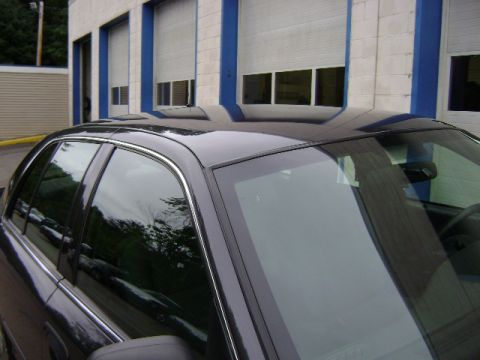2001 Ford Crown Victoria - The distinctive body style of this 2001 Ford Crown Victoria is visible from a 3/4 front perspective.