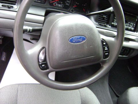 2001 Ford Crown Victoria - Interior view of a 2001 Ford Crown Victoria, showing the steering wheel, dashboard, and seats.