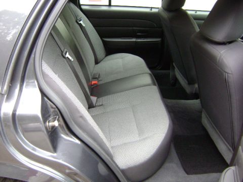 2001 Ford Crown Victoria - The interior view shows the rear seating area of a sedan, focusing on the seats and door panel.