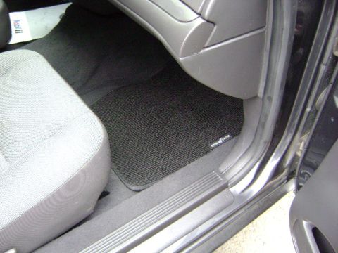 2001 Ford Crown Victoria - Black Goodyear floor mats are visible on the passenger side of the car's interior.