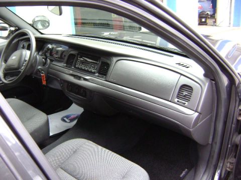 2001 Ford Crown Victoria - The interior of a 2001 Ford Crown Victoria is visible from the passenger side door.