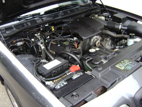 2001 Ford Crown Victoria - Engine bay of a 2001 Ford Crown Victoria showing the V8 engine and associated components.
