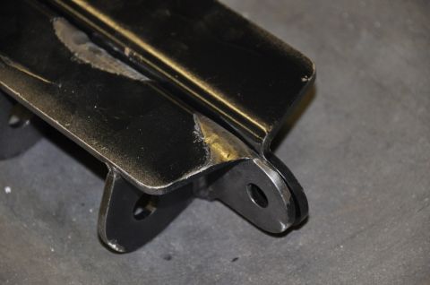1996 Ford Bronco - This is a close-up view of a metal bracket, showing its welded construction and attachment points.