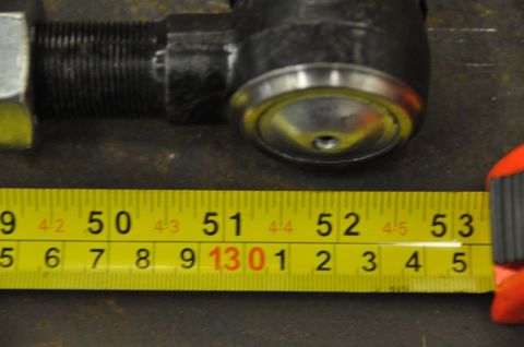1996 Ford Bronco - A close-up shows a steering component and a measuring tape indicating its size.