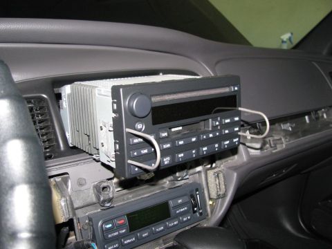 2003 Mercury Marauder - After removing the passenger side trim panel that runs between the head unit and temp controls, remove the head unit.